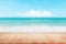 Wood table top on blurred blue sea and white sand beach background - can be used for display or montage your products