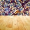 Wood table top with bokeh from decorative light on Christmas tree in background