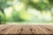 Wood table top on nature green blurred background