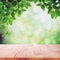 Wood table top on nature green bokeh abstract background