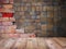 Wood table top over square clay tiles and brick wall pattern