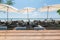 Wood tabletop on dining table with umbrella on the beach