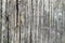 Wood texture - dark destroyed fiber of old wooden buildings