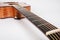 Wood texture of lower deck of six strings acoustic guitar on white background. guitar shape