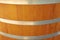 Wood texture. The texture of the wooden barrel. Wooden barrel with metal rings. Light wood texture for barrels