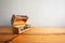 Wood vintage old treasure chest opened on  a wooden table and gray wall