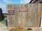 Wood wall with footwash station pet area thank you for not smoking signs at beach