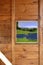 Wood window solar plates meadow view