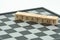 Wood word strategy placed on chessboard with a chess piece on th