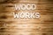 WOOD WORKS words made of wooden block letters on wooden board