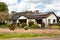 Woodbridge, Suffolk, UK April 30 2021: A small traditional bungalow with solar panels on the roof. Green energy solar energy