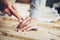 Woodcarver tool cuts the wood on table