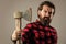 Woodcutter in a plaid shirt. Lumberjack brutal bearded man in red checkered shirt. concept of shaving. halloween. man