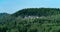 Wooded hilly landscape with limestone cliff