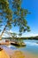 Wooded shore of Jezioro Gwiazdy lake with wooden jetty platform in Bukowo Borowy Mlyn Village near Bytow of Pomerania in Poland