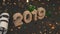 Wooden 2019 number with confetti and serpentine