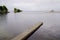 Wooden access empty jetty pontoon sunrise in water winter on Lake Sanguinet in Gironde france