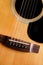 Wooden acoustic guitar closeup