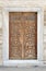 Wooden aged engraved door and exterior stone wall, Istanbul, Turkey