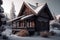 wooden alpine house with snow-covered roof exterior of the winter chalet