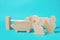 Wooden animals and fence on light blue background. Children\\\'s toy