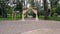 Wooden arch with curtains for ceremony on wedding day outdoors