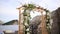 Wooden arch for the wedding ceremony at sunset.