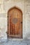 Wooden arched door in Arabic style
