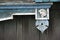 Wooden architecture of Siberia, old Windows with wooden carved architraves. old peeling paint on the wooden Windows