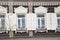 Wooden architecture of Siberia, old Windows with wooden carved architraves. old peeling paint on the wooden Windows