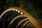 Wooden archway with decorative lighting.