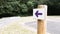 Wooden arrow purple pointing the direction of footpath for hike trail escape city path in park