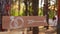 Wooden arrow sign with wedding rings on ceremony venue. Wedding party banner post . Direction info banner for guests in