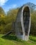 Wooden art object Nicolin Ear - a wide ear-shaped bell, located at the edge of the hill. Kaluga region, Russia