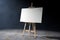 Wooden Artist Easel with White Mock Up Canvas and Palette. 3d Re