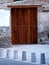 Wooden artistic door on old wall