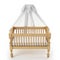 Wooden baby crib with canopy isolated on white background