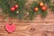 Wooden background with apples, heart and fir green