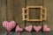 Wooden background: checked hearts of fabric and window frame.