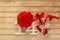 Wooden background with glasses of champagne, flowers and wooden numbers of dated 14 February. The concept of Valentine Day and