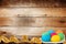 Wooden background with multicolored eggs