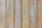 Wooden background of shabby boards with worn orange paint