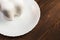 wooden background. white plate. Gypsum tooth. equipment