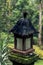 Wooden balinese lamp outdoors in the jungle rainforest of Bali island, Indonesia. Tropical background. Vintage asian