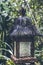 Wooden balinese lamp outdoors in the jungle rainforest of Bali island, Indonesia. Tropical background. Vintage asian