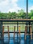 Wooden bar stools and wooden counter bar on terrace on river view background