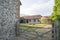 Wooden Barn Gate with View of Backyard of Vacation Houses