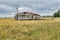 Wooden barn in the middle of a farm captured in Foxton, New Zealand