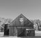 Wooden barn in sunshine with quilt