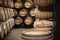 Wooden barrel with copy space on top and winery vault interior on background